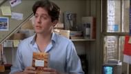 Grant as the book seller (Image via YouTube/Universal Pictures)